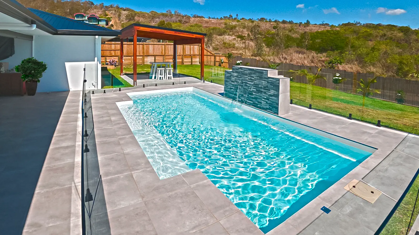 ShimmerSky_Hero A Leisure Pools inground swimming pool in Shimmer Sky color
